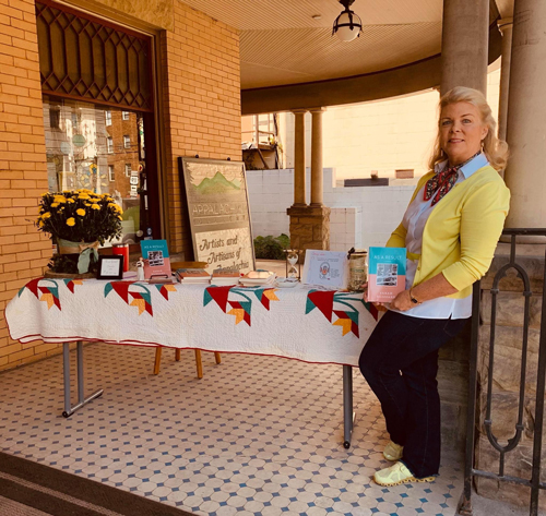 Sarah Blizzard, author selling her book at an Art Walk